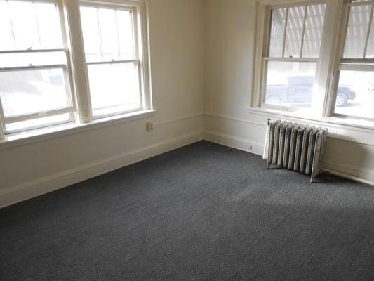 The front room, living room. Looks clean to me. The units are rented to people starting out.