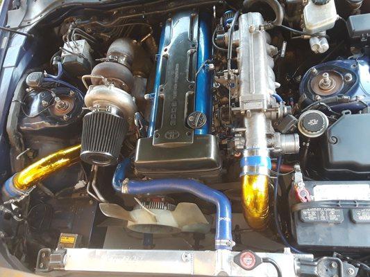 This is the after picture of the way cleaner engine bay (after the custom engine wiring harness work)