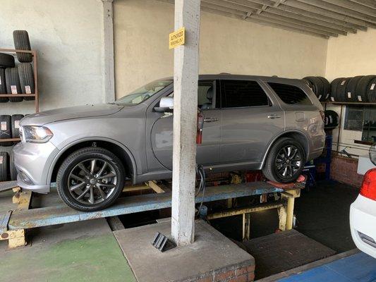 Our Alignment specialist, Mike, performing a 4 wheel alignment on a Dodge Durango. Another happy Customer!