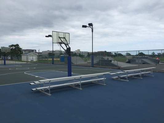 Outdoor basketball court and skateboarding ramps