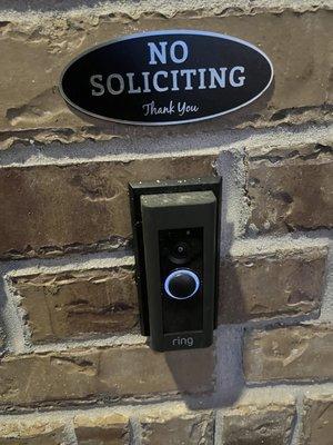 Very Clear 'No Soliciting' sign right above my doorbell.