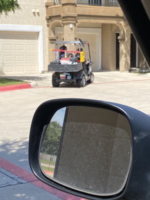 More muscular brown man on the right usually driving the cart. You see the smaller white guy slouching into the seat.