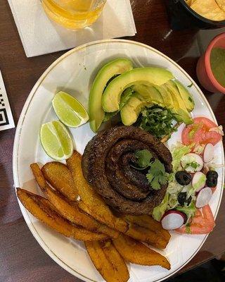 Churrasco: Grilled skirt steak, served with two sides