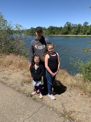 The hubs and my 2 girls next to the river