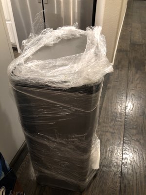 Does a trash can really need to be wrapped this heavily? They left it wrapped for me to undo