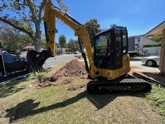 Our backhoe man working hard.