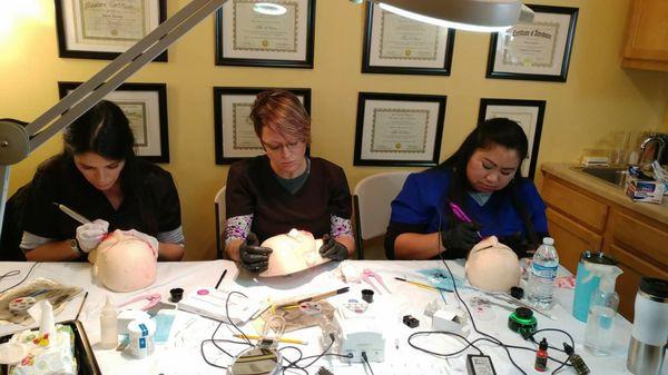 Our students getting trained in permanent makeup.