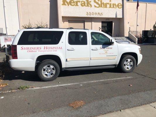 Shriners vehicle parked in front