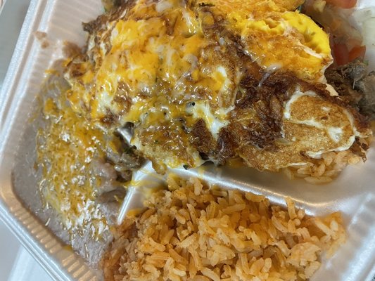 Steak, rice, eggs and favabeans.