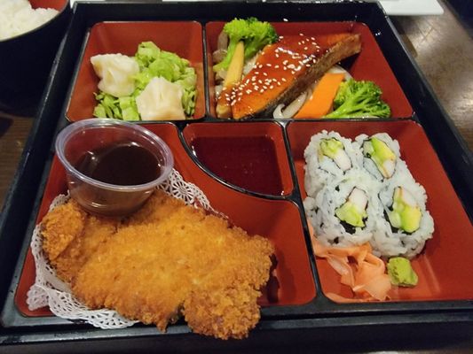 Lunch bento box with pork katsu and teriyaki salmon