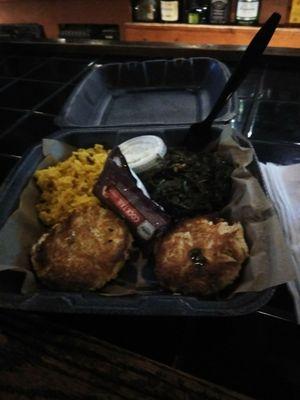 Crab cakes greens and rice.