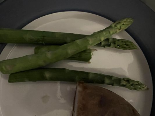 The 4 pieces of asparagus we received for a $2 up charge.  Plain steamed, no oil or seasonings.