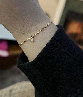 Gold permanent bracelet with charm