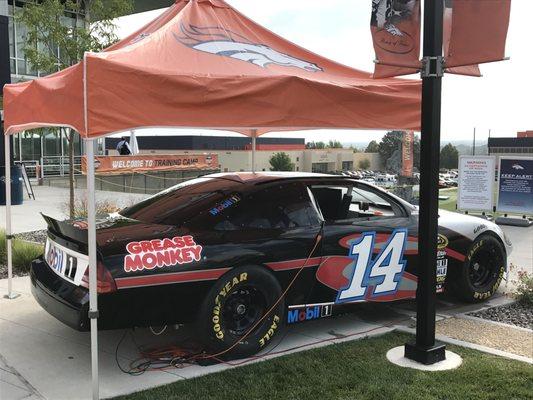 The Grease Monkey Car on display at Broncos Training Camp. We are proud partners of your Denver Broncos!