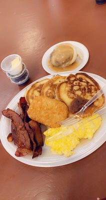 Pancakes, chopped steak , eggs, bacon and hash brown.