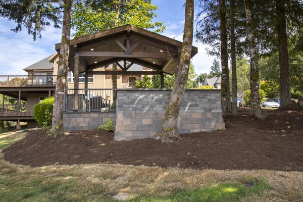 Patio Cover with Retaining wall to level with the Patio Pavers.