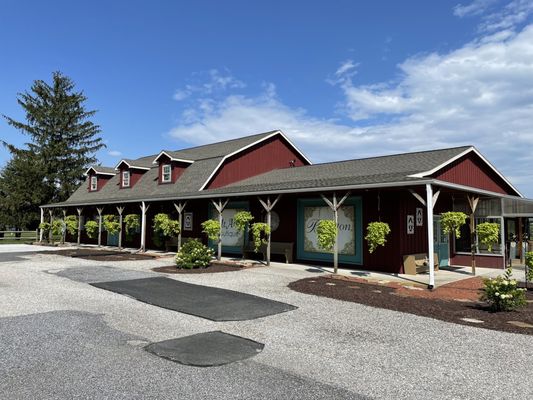 The rest of the front of the large establishment which also has fruit and vegetables.