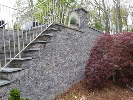 Livolsi Hardscaping installed a  retaining wall wall with steps.