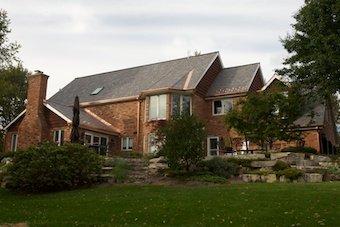 We installed all maintenance free products on this house. Davinci Slate Multi-Width Tiles, James hardie fiber cement trim, copper gutters.