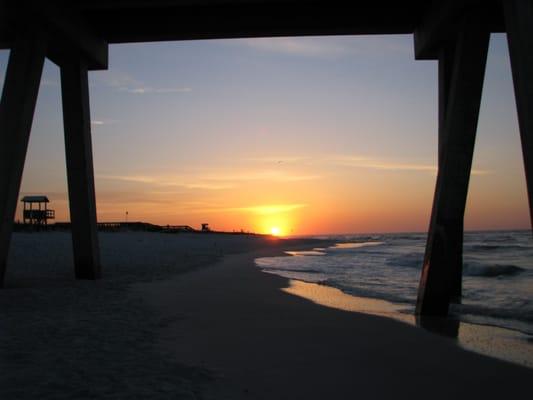 Sunrise at Navarre Beach from under the pier.