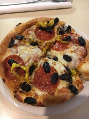 Personal pan pizza with pepperoni, black olives and banana peppers