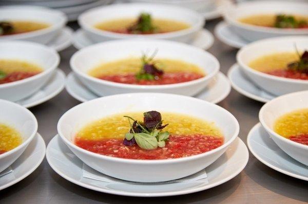 Two soups in one bowl: red and yellow gazpacho