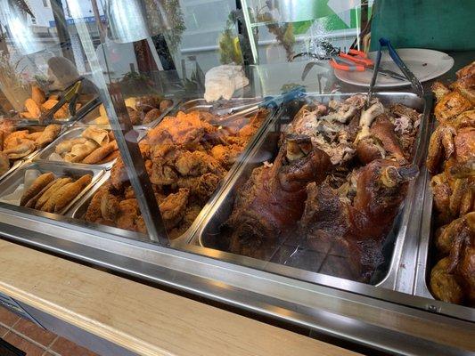 Different empanadas ,  roasted and fried chicken, and pernil