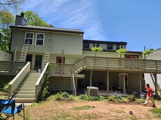 Siding and sheathing installation. Exterior paint job.