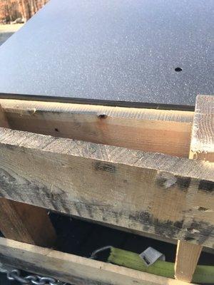 Safe over pallet board causing uneven and wobbly