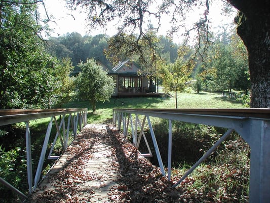 Path to house over winter creek bridge