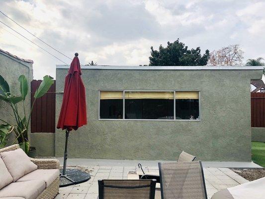 Painted bonus room stucco wall.