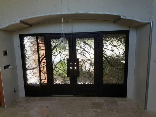 New steel entry door with arched ceiling