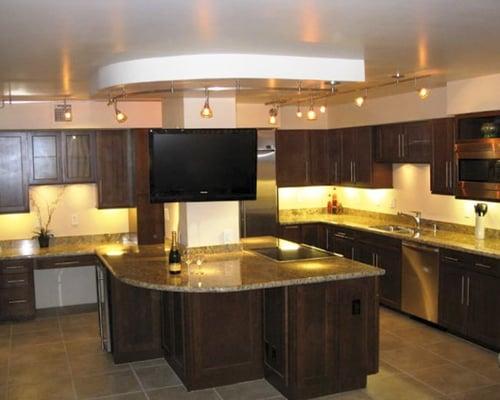 This high rise remodel kitchen included the challenges of a concrete ceiling and floor.