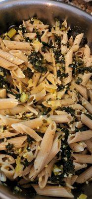 Artichoke, spinach and garlic pasta dish, simmered in extra virgin olive oil and minced onions.