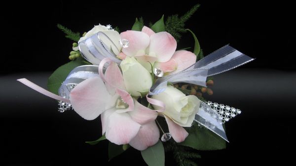 Dendrobium and Spray rose Wristlet.  Can be customized to your taste.