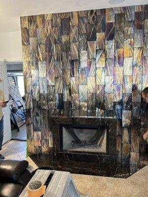 Family Room After Garden District Metallic Glass Tile wall, and St Laurent Marble Boxed Fireplace