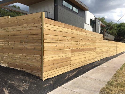 This is a cedar fence we built, using 1x4 and 1x8 boards.