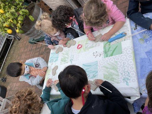 Crafting ceramic butterflies.