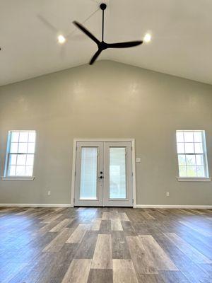 French doors from great room to spacious wrap-a-round porch