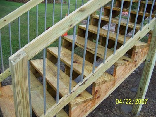 Exterior P.T. wood staircase w/gal. tube balusters