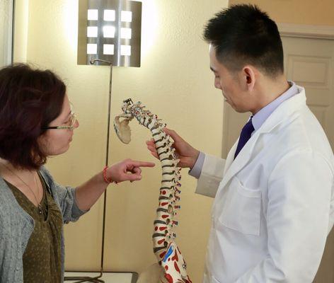 Dr. Victor Shu explaining to patient about the spine