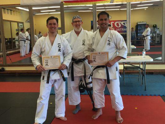 Sensei Greg Gudson with two of his students.