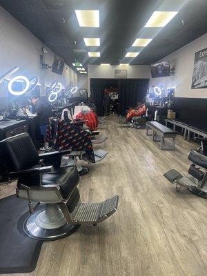 This is a view of the inside of the barbershop from the front of the shop by the register