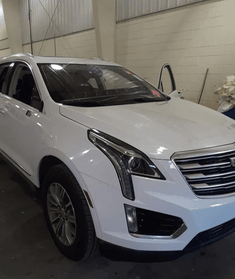 Cadillac SUV Buffed and headlights restored.