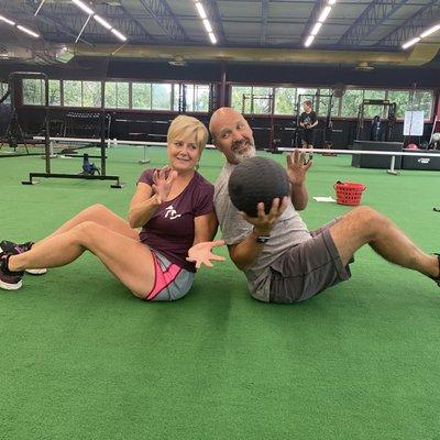 Husband and wife work out together at Sorg Sport and Wellness.