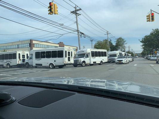 All double parked around the block causing a hazard