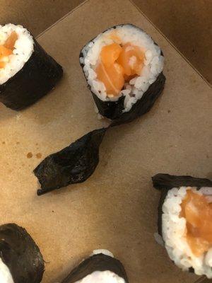 Salmon roll. Light in the fish & rice, heavy on the soggy, chewy nori. Had to trim off all this excess nori on nearly every bite  :/