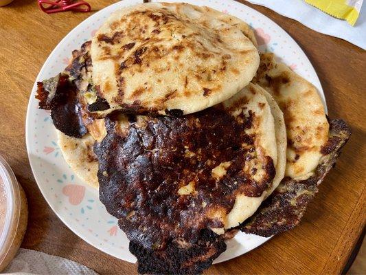 Burnt pupusas with all the cheese leaked out. Every single one was garbage