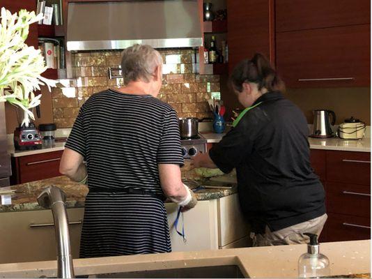 Our team member helps customer chop veggies for her dinner after she broke both of her wrists!