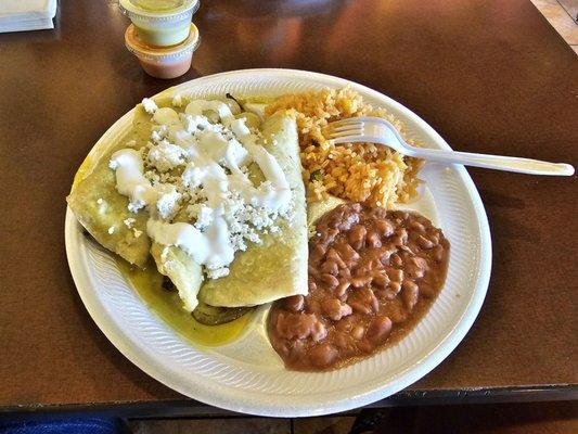 Chicken enchiladas with rice and beans